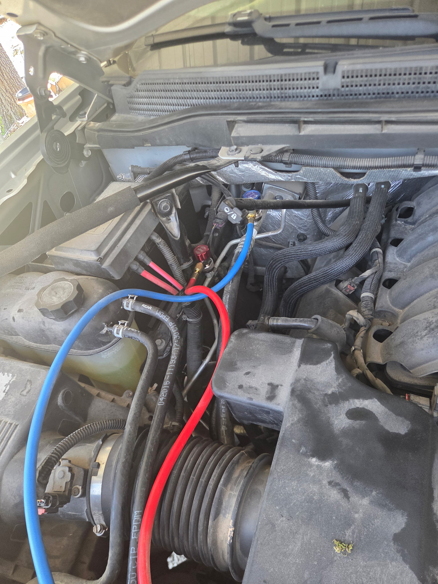 Engine bay with AC diagnostic gauges