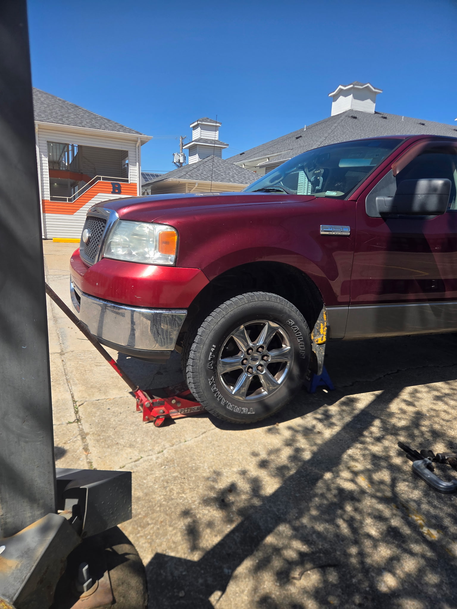 Ford F150 on jack for emergency service
